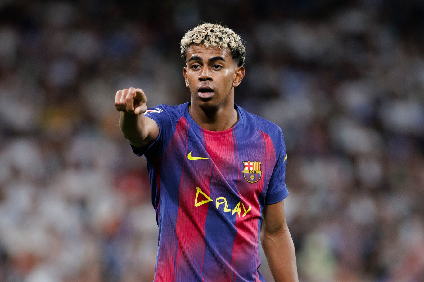 Young footballer directing play on the field